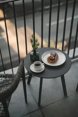 a table with a plate with a donut on it at Moon apartment 2 in Podgorica