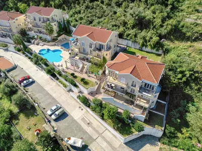 an overhead view of a large house with a pool at Kotor Vista Seaview apartment by MN Property in Muo