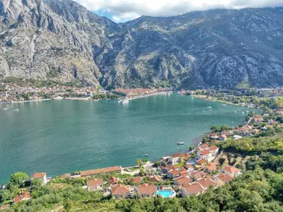 an aerial view of a town on the shore of a lake at Kotor Vista Seaview apartment by MN Property in Muo