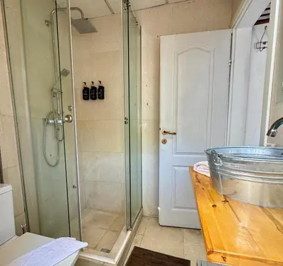 a shower with a glass door in a bathroom at Waterfront Villa Magnolia in Kotor