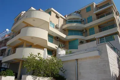 an apartment building with balconies on the side of it at Villa Nova Premium Apartment No 8 in Petrovac na Moru