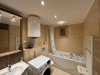 a bathroom with a tub and a sink and a bath tub at Villa Nova Premium Apartment No 8 in Petrovac na Moru