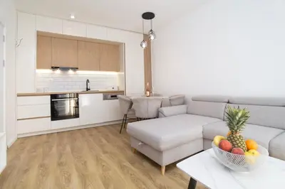 a living room with a couch and a table with a bowl of fruit at Montenegrina apartment in Cetinje