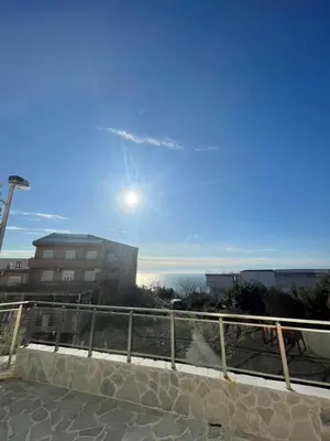a view of the ocean from a balcony of a building at Casa Klei in Ulcinj