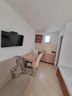 a living room with a couch and a table at Apartman-Studio Matanović- Save Kovačevića in Sutomore