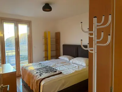 a bedroom with a bed and a large window at Villa Nova Premium Apartment No 5 in Prijevorac