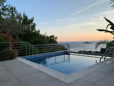 a swimming pool with a view of the ocean at Villa Nova Premium Apartment No 5 in Prijevorac