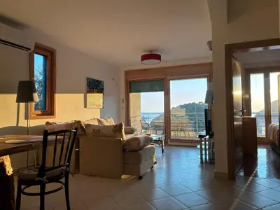 a living room with a couch and a table at Villa Nova Premium Apartment No 5 in Prijevorac