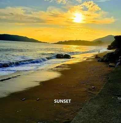 a sunset on a beach with the words sunset at Sea & Mountain View Apartment in Budva