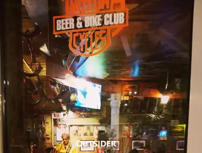 a sign for a beer and bike club in a bar at Sea & Mountain View Apartment in Budva