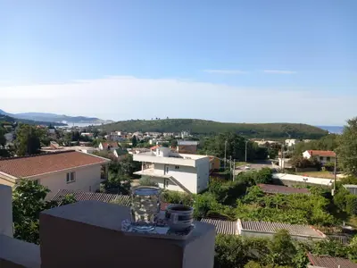 a glass vase sitting on top of a building at Apartmani Todorović in Bar