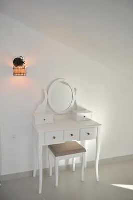 a white dressing table with a mirror and a stool at Green Ranch Stara Maslina in Kotor