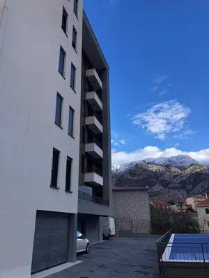 a white building with a view of a mountain at Sweet Escape in Bar