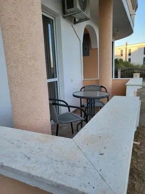 a table and chairs on the balcony of a building at CC Apartments in Ulcinj