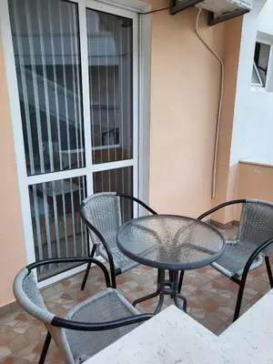a patio with a table and chairs on a balcony at CC Apartments in Ulcinj