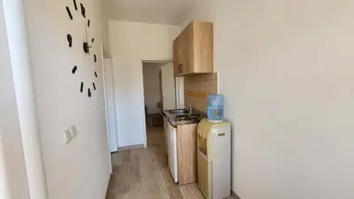a small kitchen with a sink and a refrigerator at CC Apartments in Ulcinj