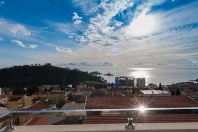 a view of the ocean from a city at Apartment Taurus in Petrovac na Moru