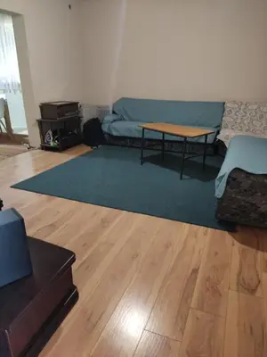 a living room with a couch and a table at Tangerine terrace in Ulcinj