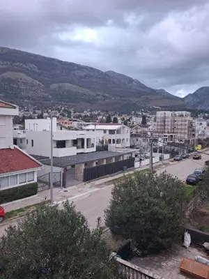 a view of a city with mountains in the background at Apartments D&D Sutomore in Sutomore