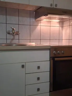 a kitchen with a sink and aaucet at Apartments D&D Sutomore in Sutomore