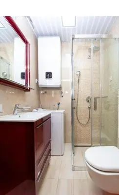 a bathroom with a shower and a toilet and a sink at Apartman BJANKA in Budva