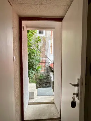an open door with a view of a stairway at Apartments Bella in Kotor