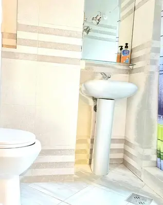 a bathroom with a sink and a toilet at Apartments Bella in Kotor