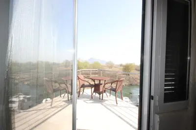 a patio with a table and chairs on a balcony at Apartment Biba in Virpazar