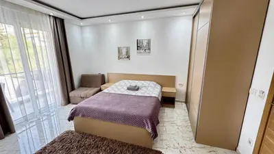 a small room with a bed and a window at Apartmani Bar Zeleni Pojas in Bar