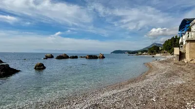 a rocky beach with rocks in the water at Apartmani Bar Zeleni Pojas in Bar