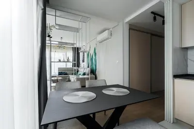 a dining room table with two white hats on it at Como residence by InProperty in Budva