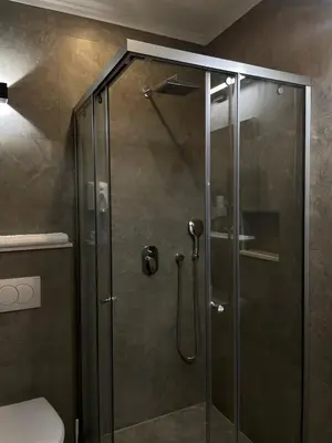 a shower with a glass door in a bathroom at Vue Mer in Ulcinj