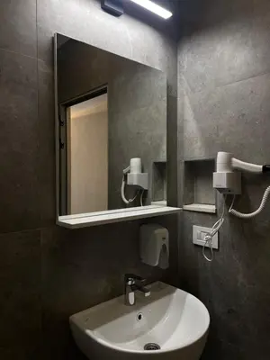 a bathroom with a sink and a mirror at Vue Mer in Ulcinj