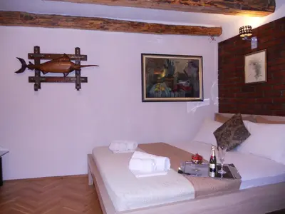 a bedroom with a bed with a tray on it at Apartment Djukovic in Petrovac na Moru