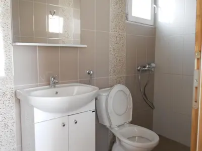 a bathroom with a sink and a toilet at Apartment Djukovic in Petrovac na Moru