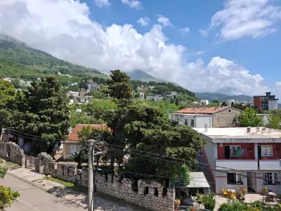 a view of a city with mountains in the background at Adriatica 1 in Sutomore