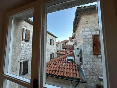 a view from a window of an old building at Charming apartment with a terrace in Kotor