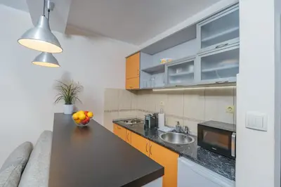 a kitchen with a sink and a counter top at Apartments Spin in Budva