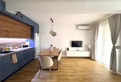 a kitchen with a table and chairs in a room at Apartment Simovic in Cetinje