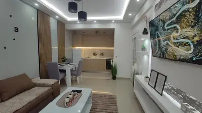 a living room with a couch and a table at AJKULICA Apartman in Bar