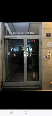 an entrance to a building with a glass door at City kvart 2 bedroom apartment in Podgorica
