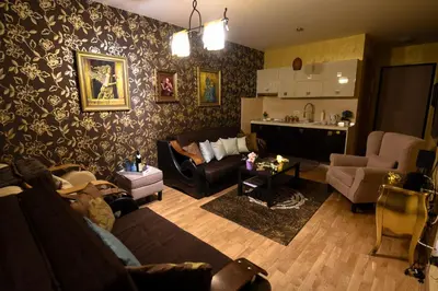 a living room with a couch and a table at Apartment Godfather in Budva