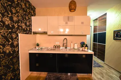 a bathroom with a sink and a counter top at Apartment Godfather in Budva