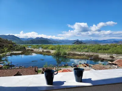 a view of a river from a roof at Luxurious attic apartment with a breathtaking view in Vranjina