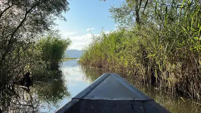 a view from the back of a boat on a river at Luxurious attic apartment with a breathtaking view in Vranjina
