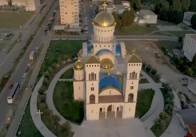 an aerial view of a church with a gold dome at Studios Zoran Milosev in Bar
