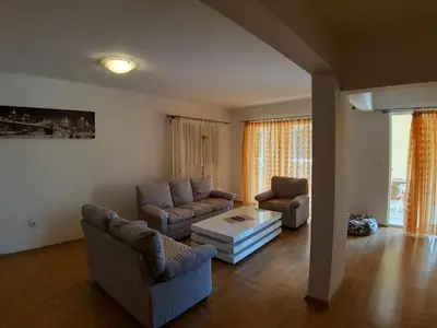 a living room with two couches and a coffee table at Apartmani Jovan in Budva