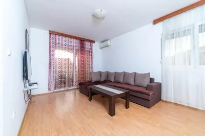 a living room with a couch and a table at Apartmani Jovan in Budva
