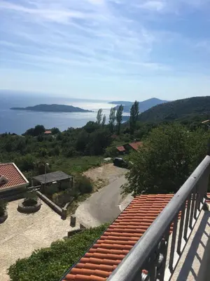 a view of the ocean from a balcony at Apartments Kuljace in Sveti Stefan