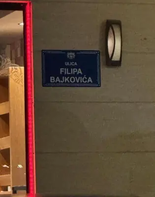 a blue sign that reads filipina bologna at City kvart apartment in Podgorica